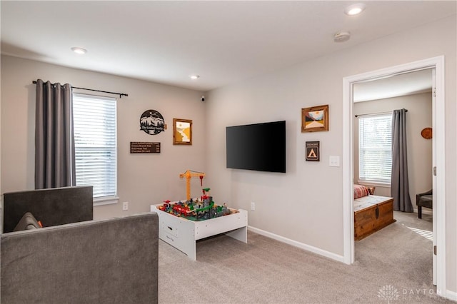 living room featuring light colored carpet