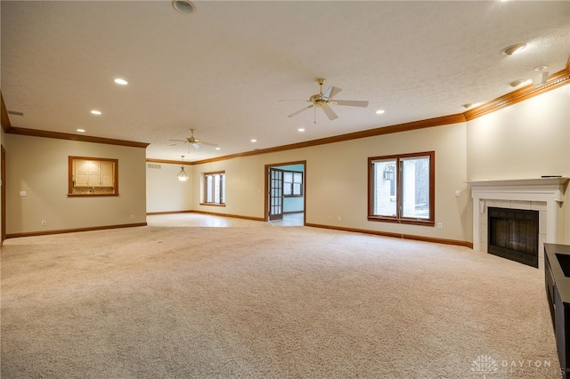 unfurnished living room featuring light colored carpet, a fireplace, ceiling fan, and baseboards