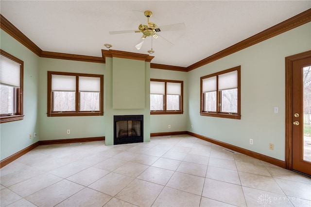 unfurnished living room featuring baseboards, ceiling fan, ornamental molding, and light tile patterned floors