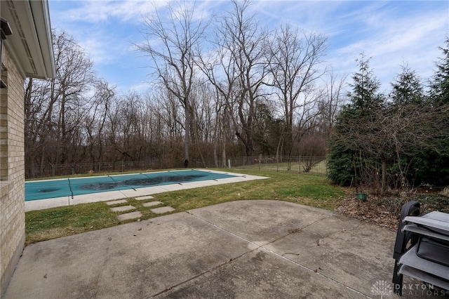 view of pool featuring fence, a lawn, a patio area, and a fenced in pool