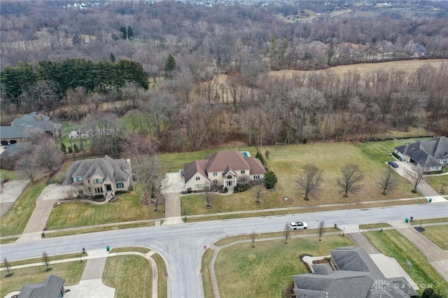 aerial view featuring a wooded view
