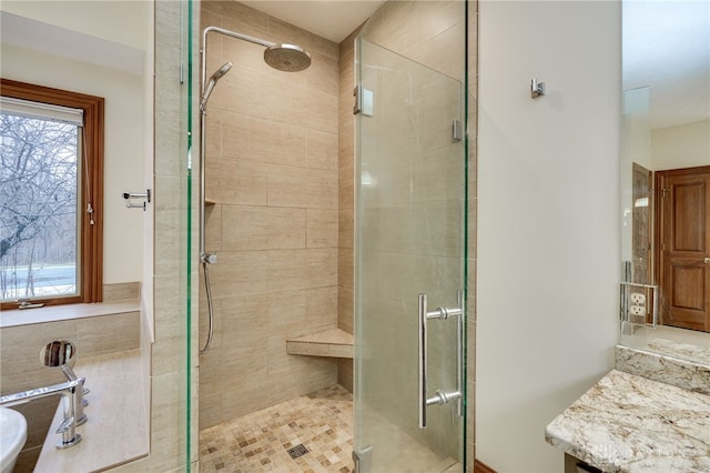 full bath with a wealth of natural light and a stall shower