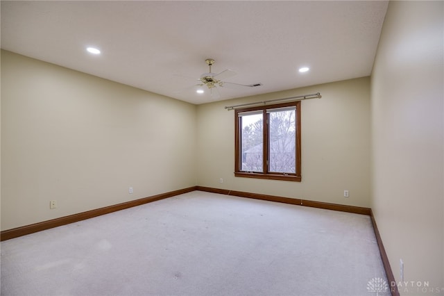 empty room featuring a ceiling fan, light carpet, baseboards, and recessed lighting
