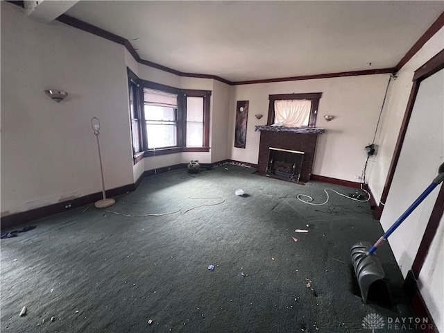 unfurnished living room featuring ornamental molding