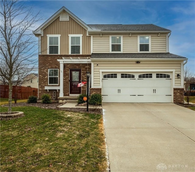 view of front of home with a garage and a front lawn