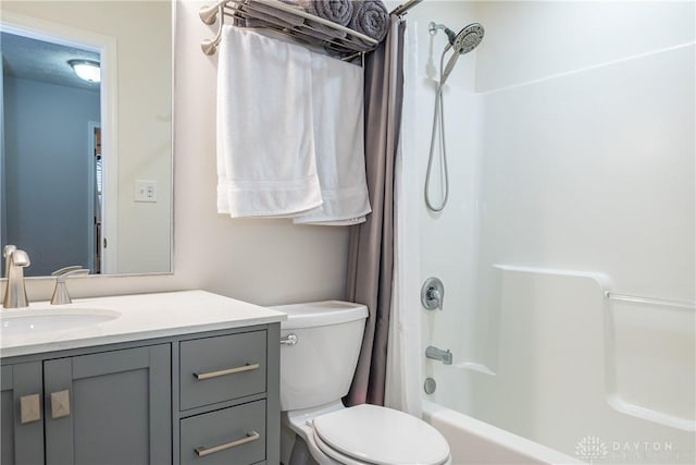 full bathroom with shower / bathtub combination with curtain, vanity, toilet, and a textured ceiling