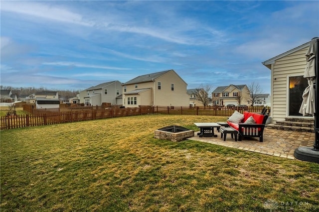 view of yard with a fire pit and a patio area