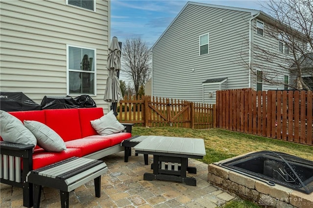 view of patio / terrace featuring an outdoor living space with a fire pit