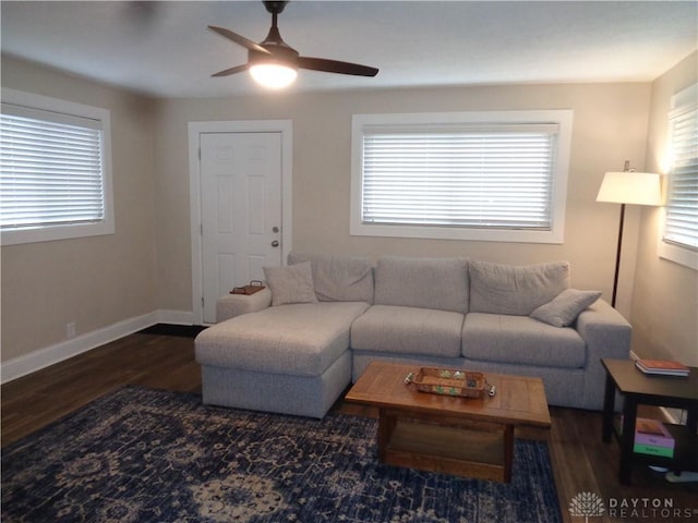 living room featuring plenty of natural light, dark hardwood / wood-style floors, and ceiling fan