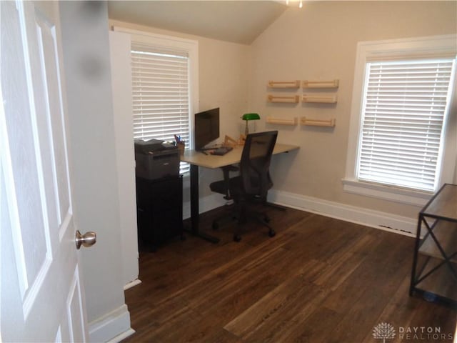 office space with lofted ceiling and dark hardwood / wood-style floors