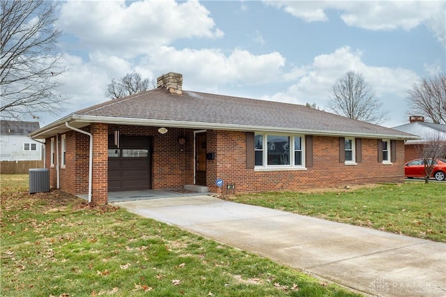 ranch-style home featuring a carport, central AC unit, and a front lawn