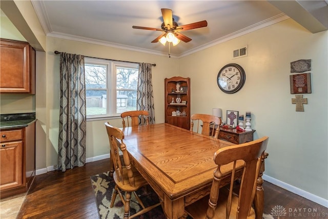 dining area featuring ceiling fan, ornamental molding, and dark hardwood / wood-style floors