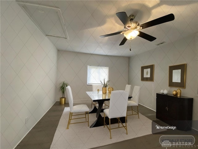 dining space featuring dark tile patterned flooring