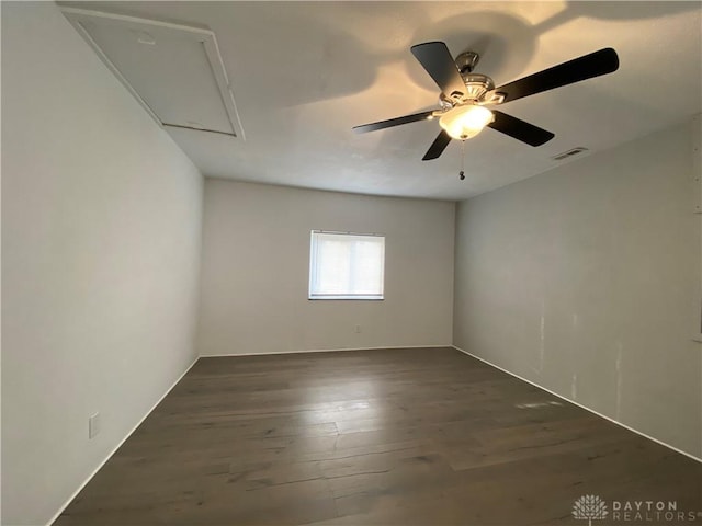 empty room with dark wood-type flooring