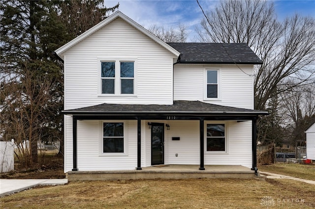 view of front property with a porch and a front lawn