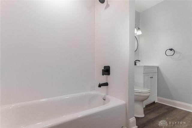 bathroom with hardwood / wood-style flooring, shower / tub combination, and toilet