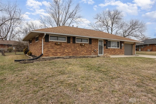 single story home featuring a garage and a front lawn