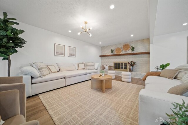 4260 Penny Pike, German Twp, OH 45502 - living room featuring light wood finished floors, a chandelier, and recessed lighting