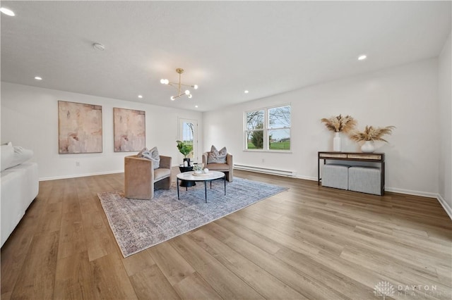 4260 Penny Pike, German Twp, OH 45502 - dining area featuring a baseboard heating unit, wood finished floors, recessed lighting, a chandelier, and baseboards
