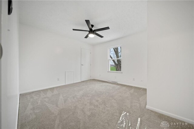 4260 Penny Pike, German Twp, OH 45502 - empty room featuring ceiling fan, carpet floors, and baseboards