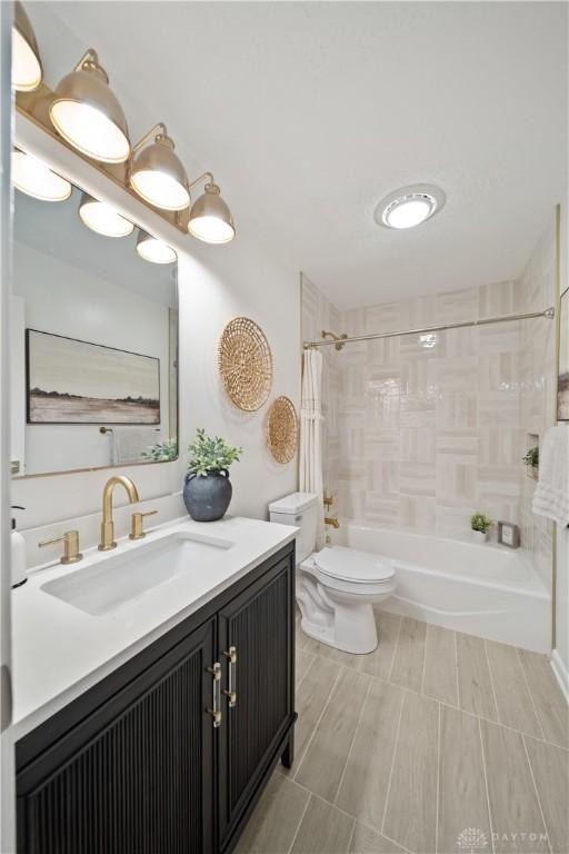 4260 Penny Pike, German Twp, OH 45502 - bathroom featuring shower / washtub combination, toilet, and vanity