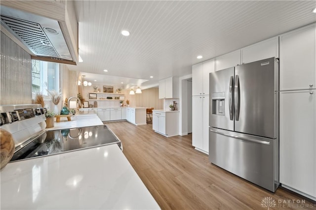 4260 Penny Pike, German Twp, OH 45502 - kitchen with stainless steel fridge with ice dispenser, light wood-type flooring, exhaust hood, white cabinets, and recessed lighting