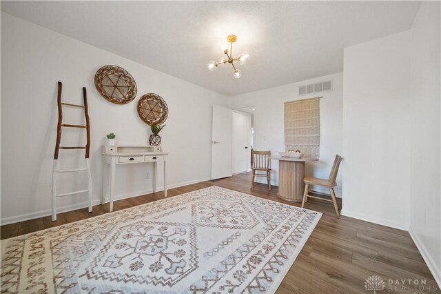4260 Penny Pike, German Twp, OH 45502 - sitting room with a chandelier, wood finished floors, and baseboards