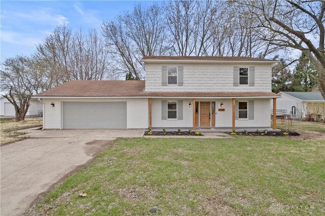 4260 Penny Pike, German Twp, OH 45502 - view of front of house with an attached garage, driveway, a front yard, a shingled roof, and stucco siding