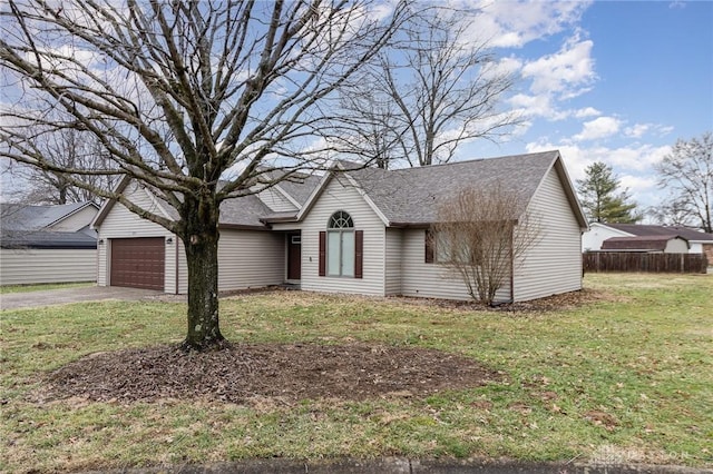 ranch-style house featuring a garage and a front yard