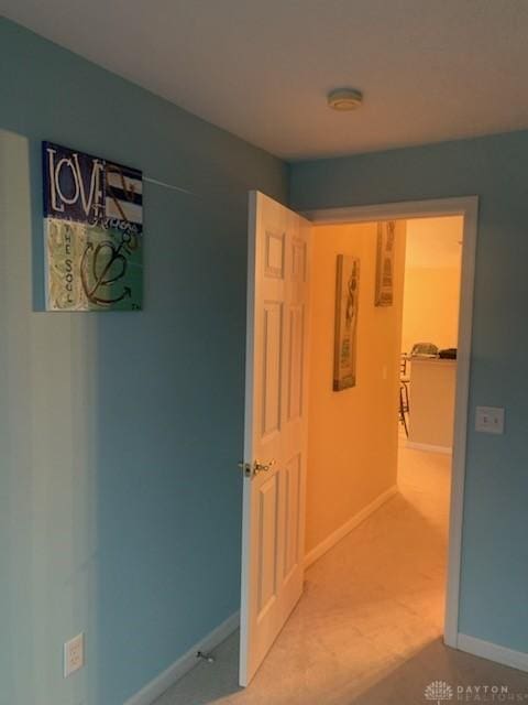 hallway featuring carpet flooring