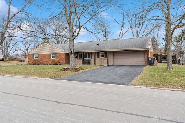 ranch-style home featuring a garage and a front yard