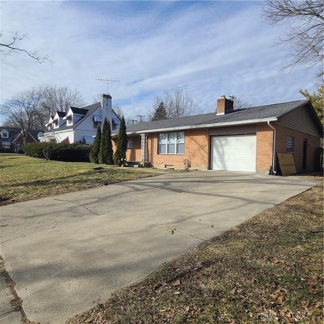 view of front facade featuring a garage and a front lawn