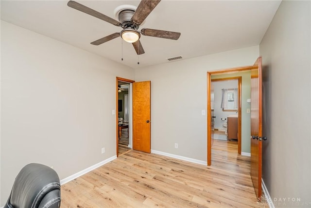 unfurnished bedroom with ceiling fan, light wood-style flooring, visible vents, and baseboards