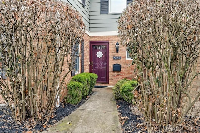 7789 Thomas Jefferson Ln, Centerville, OH 45459 - view of exterior entry featuring brick siding