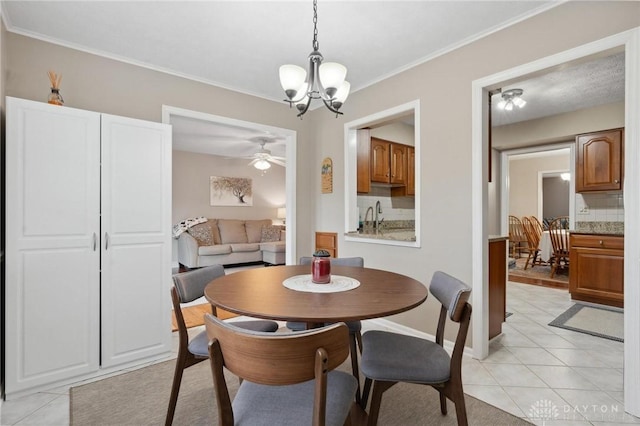 7789 Thomas Jefferson Ln, Centerville, OH 45459 - dining area with baseboards, ornamental molding, light tile patterned floors, and ceiling fan with notable chandelier