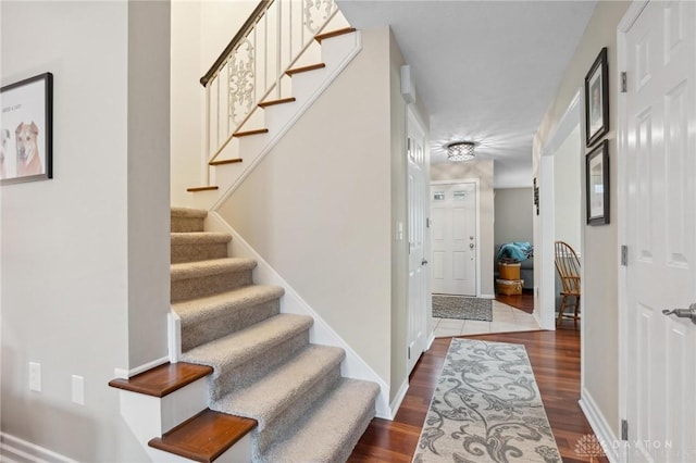 7789 Thomas Jefferson Ln, Centerville, OH 45459 - staircase with baseboards and wood finished floors