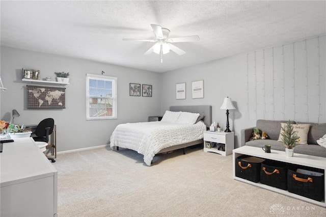 7789 Thomas Jefferson Ln, Centerville, OH 45459 - bedroom with a textured ceiling, ceiling fan, light carpet, and baseboards