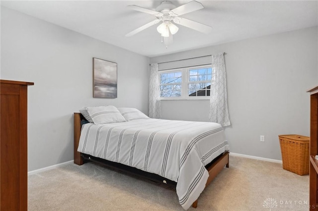 7789 Thomas Jefferson Ln, Centerville, OH 45459 - bedroom with a ceiling fan, baseboards, and light carpet