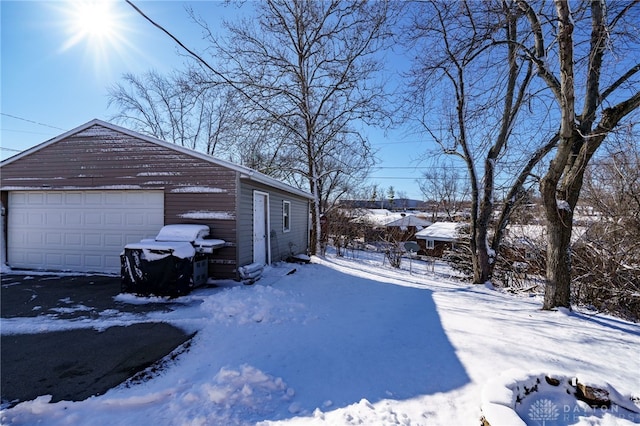 view of snow covered garage