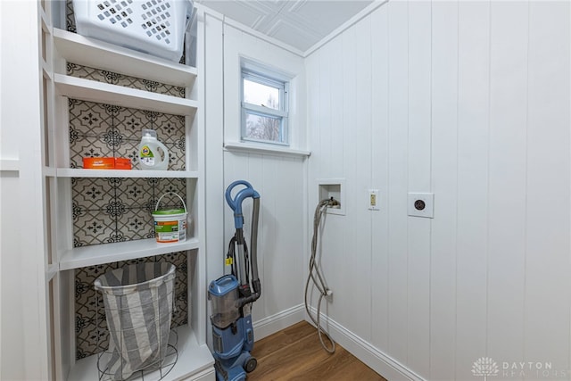 washroom featuring washer hookup, hardwood / wood-style flooring, and hookup for an electric dryer