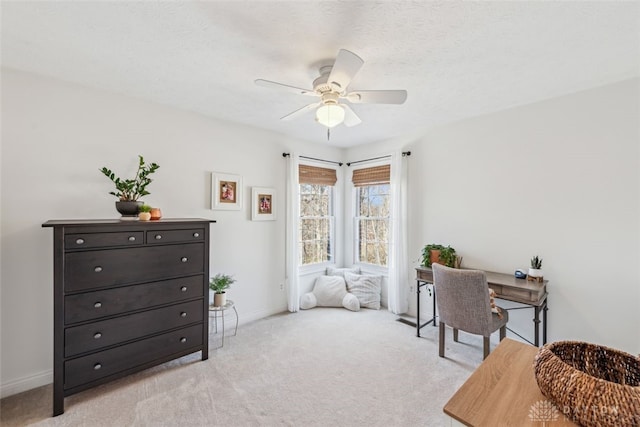 bedroom featuring a ceiling fan, baseboards, and light carpet