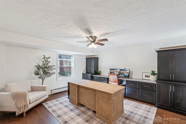 2769 Golden Fox Trl, Lebanon, OH 45036 - office featuring a textured ceiling, ceiling fan, baseboard heating, and wood finished floors