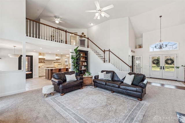 2769 Golden Fox Trl, Lebanon, OH 45036 - living area featuring stairway, high vaulted ceiling, and light carpet