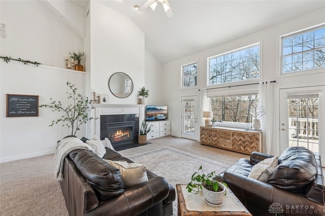 2769 Golden Fox Trl, Lebanon, OH 45036 - carpeted living room with a ceiling fan, high vaulted ceiling, baseboards, and a fireplace