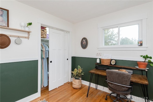 home office with hardwood / wood-style floors