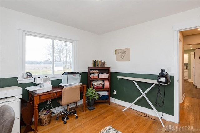 home office with hardwood / wood-style floors