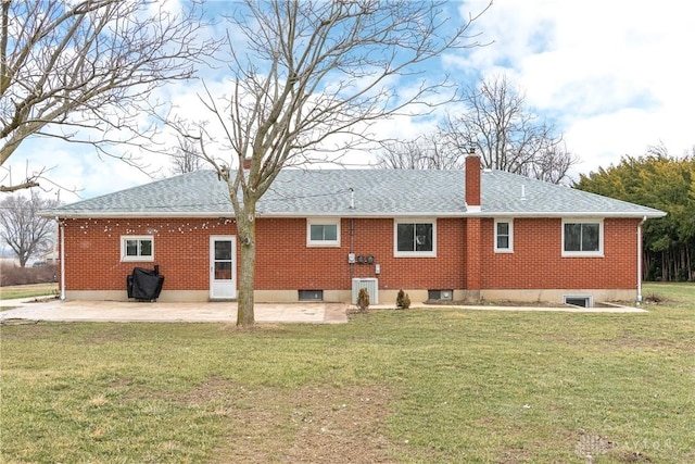 back of house featuring a yard and a patio area