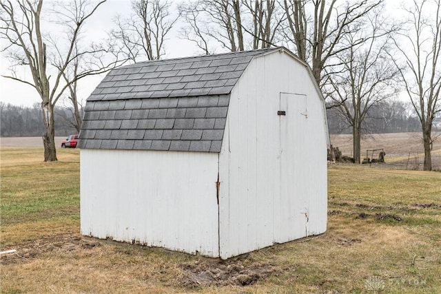 view of outbuilding with a lawn