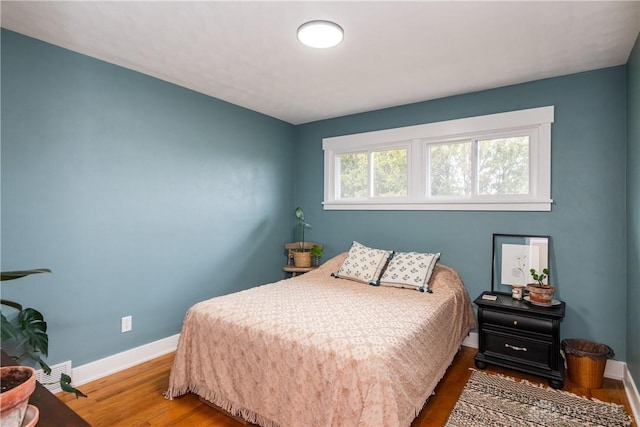 bedroom featuring wood-type flooring