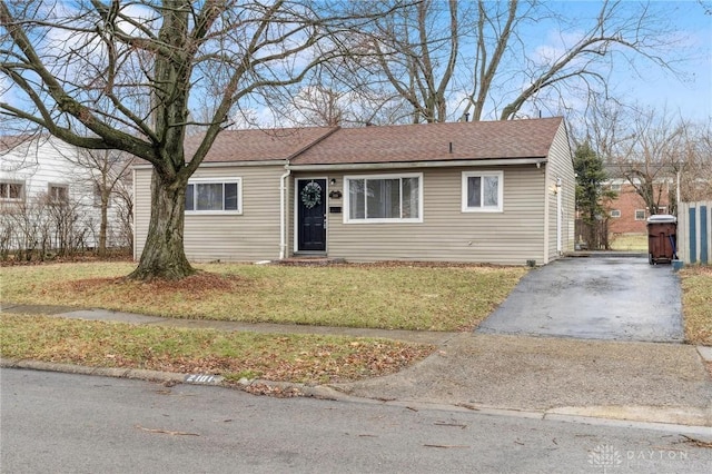 ranch-style house with a front lawn